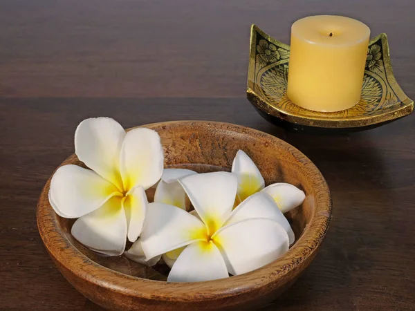 candle, lacquer wares and tropical flowers