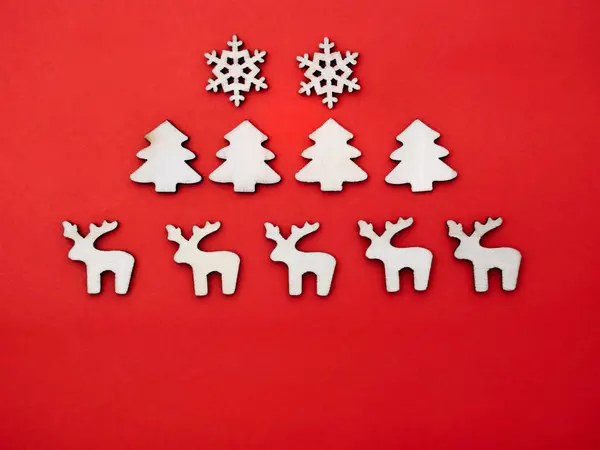 Wooden snowflakes, pine trees, and deer — Stock Photo, Image