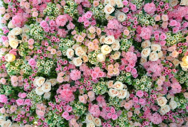 a ceiling decorated with roses and daisies in various shades of pink and yellow, backgound and texture concepts