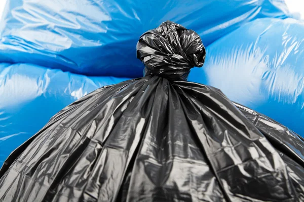 Black and blue garbage bags