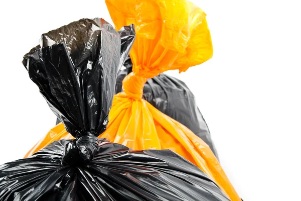 Orange and black garbage bags — Stock Photo, Image