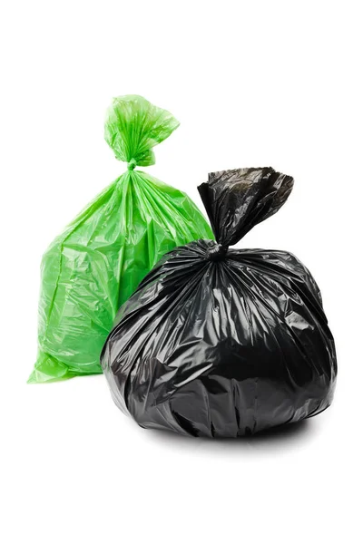 Sacos de lixo verde e preto — Fotografia de Stock