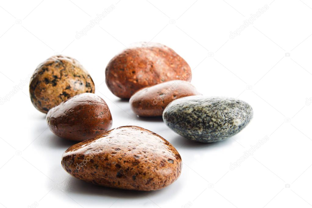 wet sea stones isolated on white background