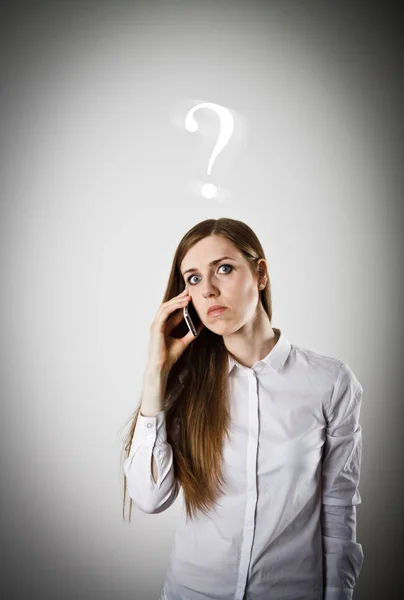 Woman in white with telephone. Question concept. — Stock Photo, Image