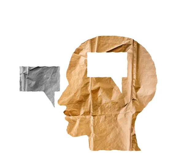 Згорнутий папір у формі людської голови та розмовної кулі на білому . — стокове фото