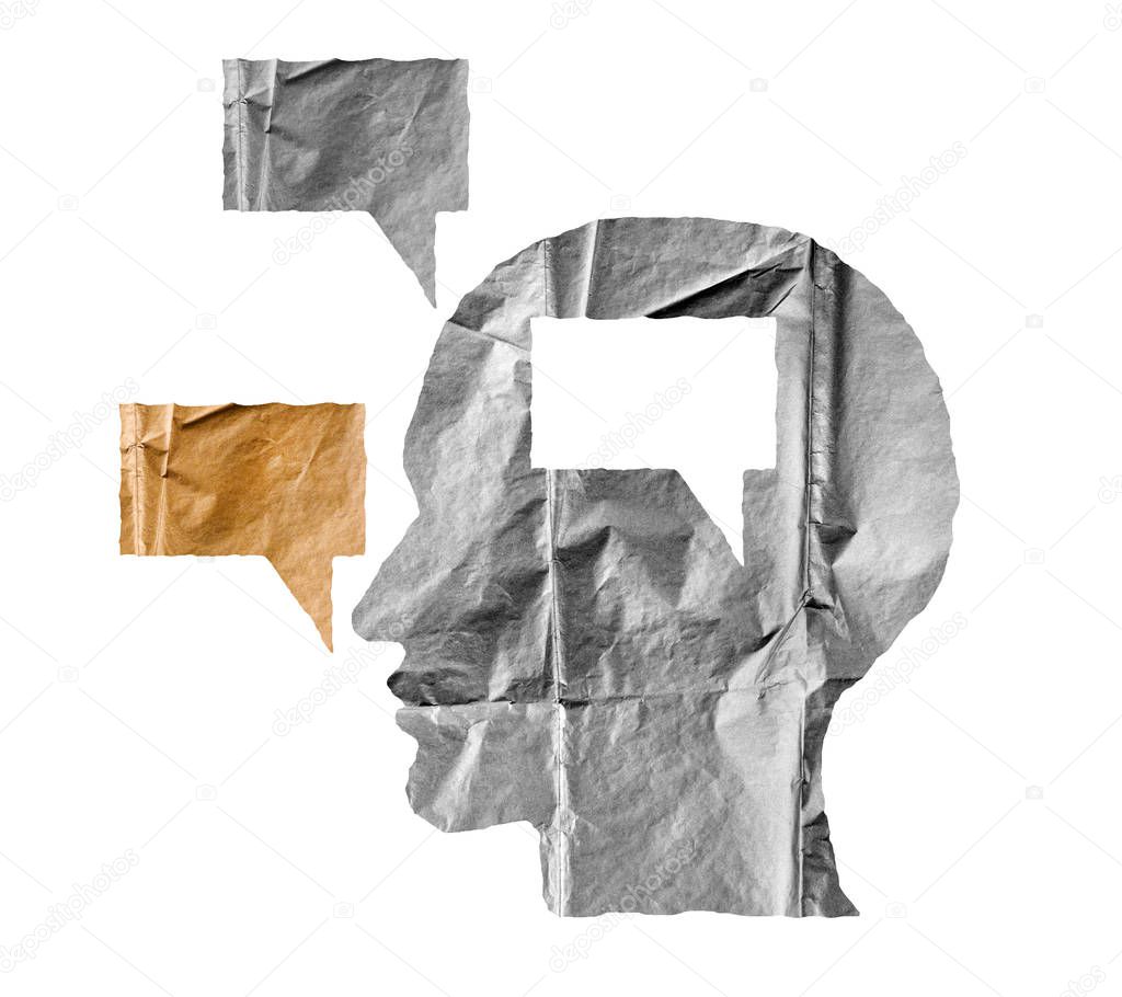 Crumpled paper shaped as a human head and talk balloon on white.
