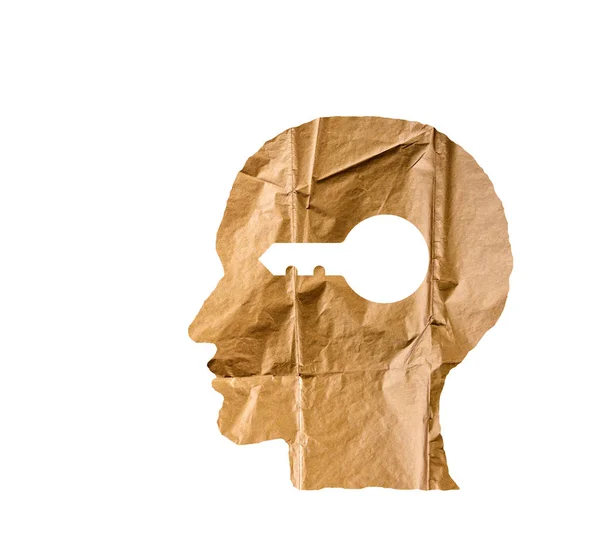 Crumpled paper shaped as a human head and key on white. — Stock Photo, Image