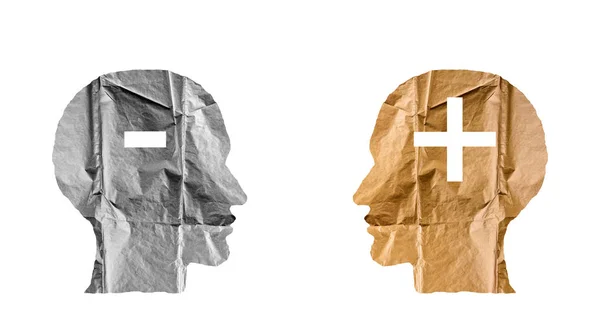 Crumpled paper shaped as a human heads and plus and minus signs. — Stock Photo, Image