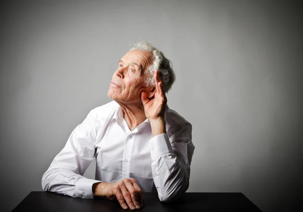 Curious old man in white — Stock Photo, Image