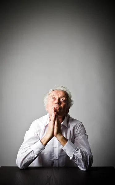 Old man is praying. — Stock Photo, Image