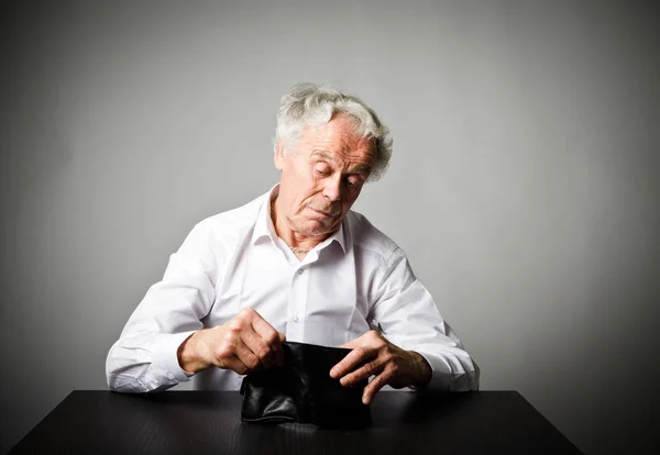 Old man in white and empty wallet. — Stock Photo, Image