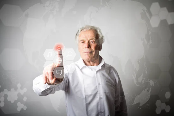 Old man in white pushing the button. Innovative technology conce — Stock Photo, Image