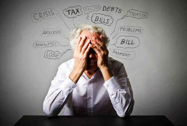 Frustrated old man in white. Many problems. — Stock Photo, Image