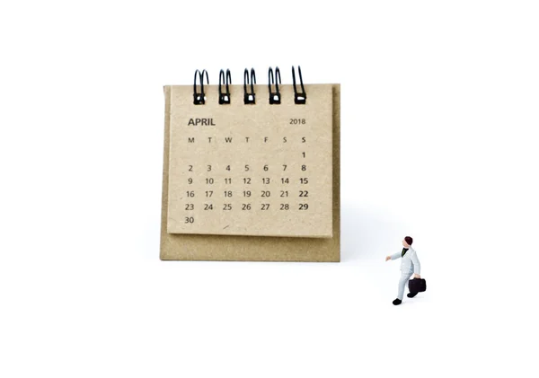 四月。日历板和微型塑料商人白色 — 图库照片