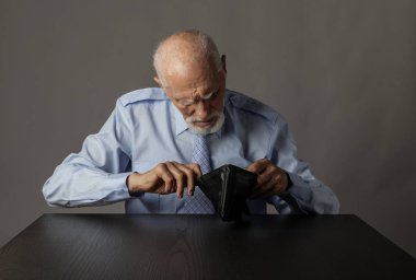 Old man in blue and empty wallet.