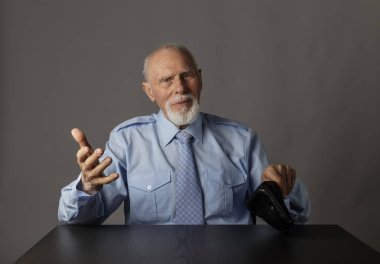 Old man in blue and empty wallet.
