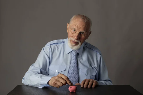 Old man holding piggy bank. Economy and saving. — Stock Photo, Image