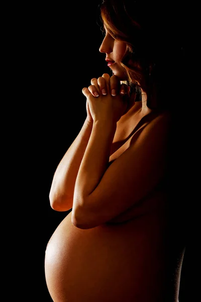 Young naked pregnant woman praying — Stock Photo, Image