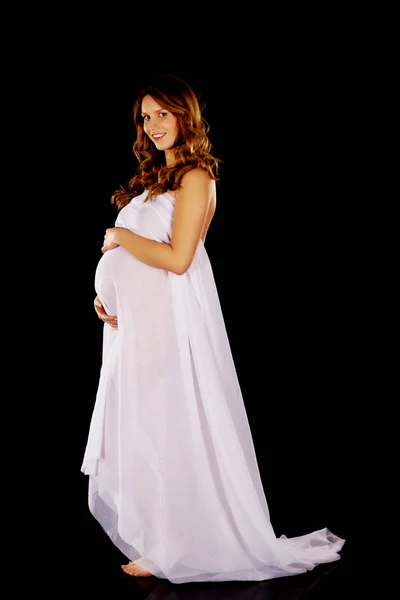 Mulher grávida bonita embrulhando no chiffon — Fotografia de Stock