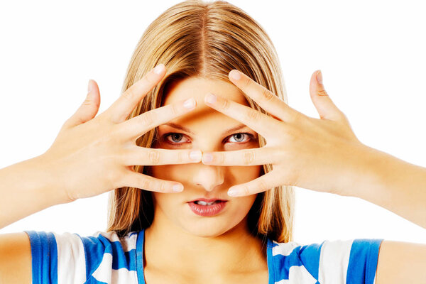 Woman covering her face with hands.