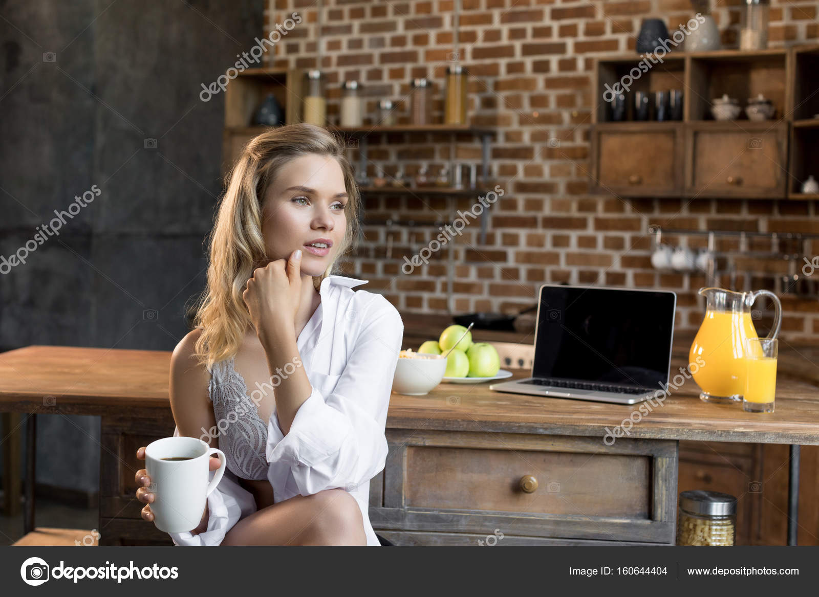 Woman having her morning coffee — Stock Photo © AntonSofiychenko 160644404
