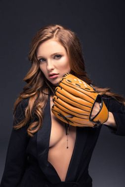 sexy woman covering with baseball mitt isolated on gray clipart