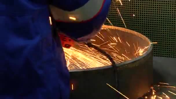 Male metal worker polishing piece of medieval armour suit — Stock Video