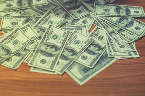 A man holds dollars in his hands, Businessman holding money in his hands, Man giving money one us dollar banknote and holding cash in hands. Money credit concept. Vertical image. Selective focus