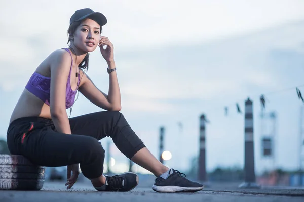 Young woman runner is jogging on the street be running for exerc — Stock Photo, Image