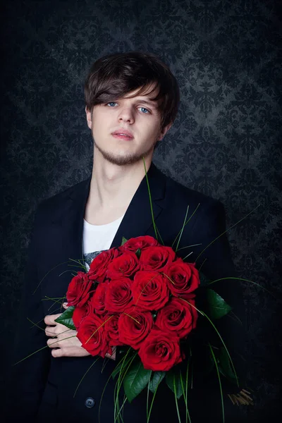 Young  man with a red roses