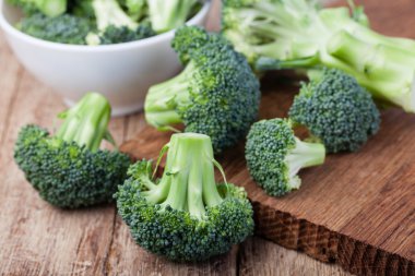 fresh broccoli on a wooden table clipart