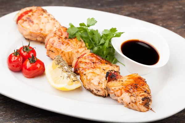 Salmon kebab on a plate — Stock Photo, Image