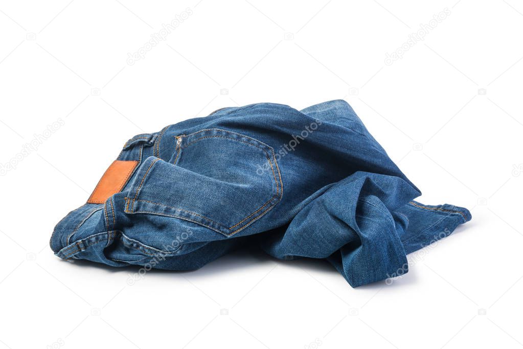 Blue jeans folded on white background