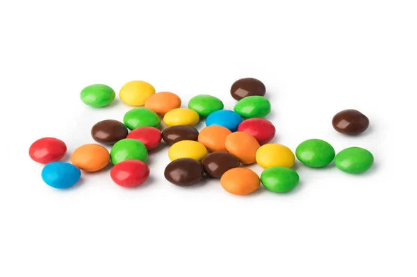 Boutons chocolat colorés sur un fond blanc — Photo