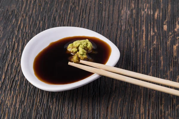 Bowl with soy sauce and wasabi — Stock Photo, Image