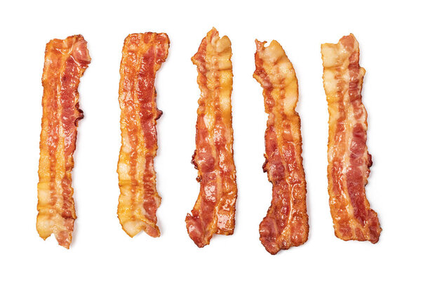 slices of crispy hot fried bacon isolated on white background