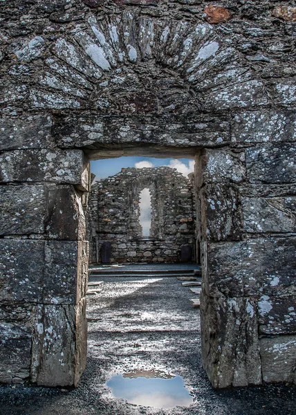 Stone gate of the ancient church ruins. Glendalough, Ireland.