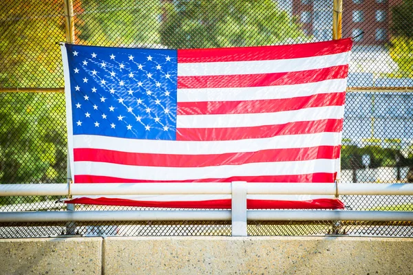 American flag on fence — Stock Photo, Image