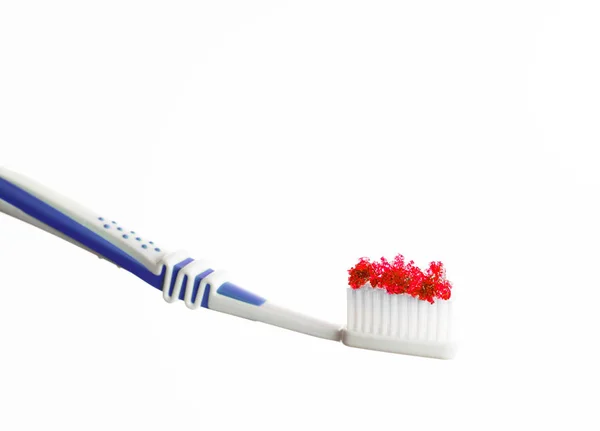 Toothbrush with red colored sugar — Stock Photo, Image