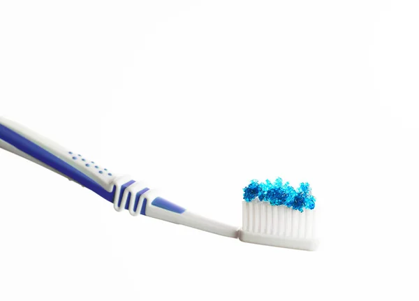 Toothbrush with blue colored sugar — Stock Photo, Image