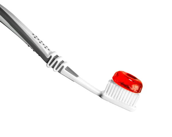 Toothbrush with red bonbon — Stock Photo, Image