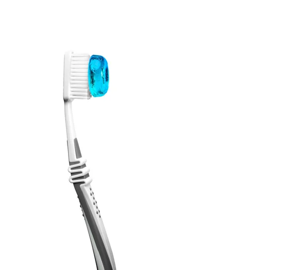 Toothbrush with blue bonbon — Stock Photo, Image