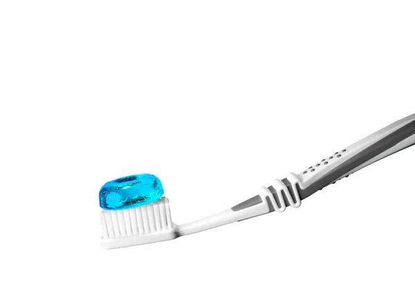 Toothbrush with blue bonbon — Stock Photo, Image