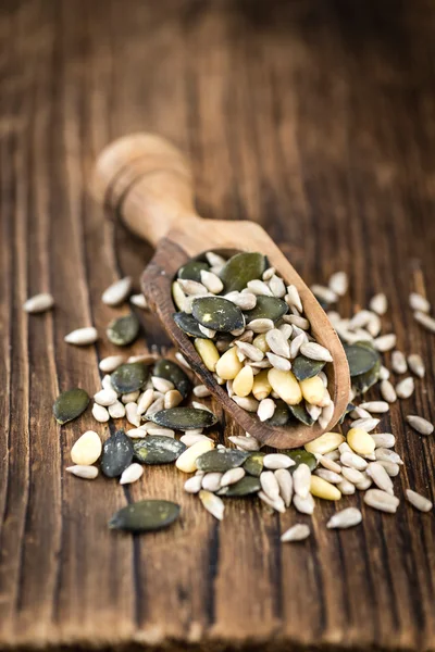 Mixed Seeds on wooden background (selective focus) — Stock Photo, Image