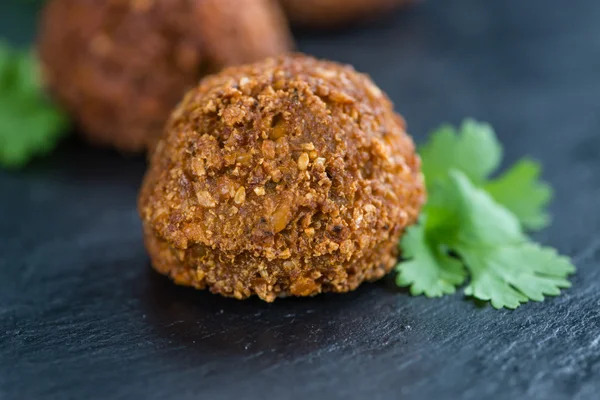 Falafels on an old wooden table — Stock Photo, Image