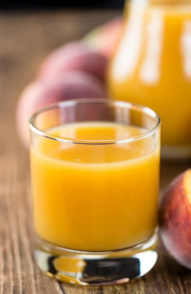 Porção de suco de pêssego — Fotografia de Stock