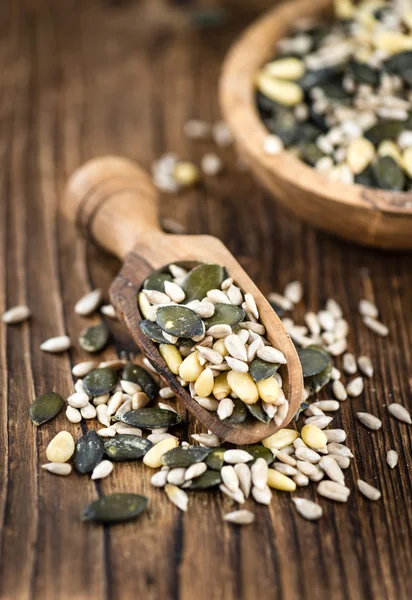 Old wooden table with mixed Seeds — Stock Photo, Image