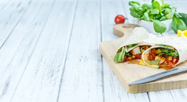 Chicken Wraps on a wooden table — Stock Photo, Image