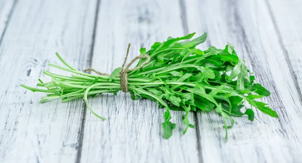 Fresh Arugula on vintage background — Stock Photo, Image