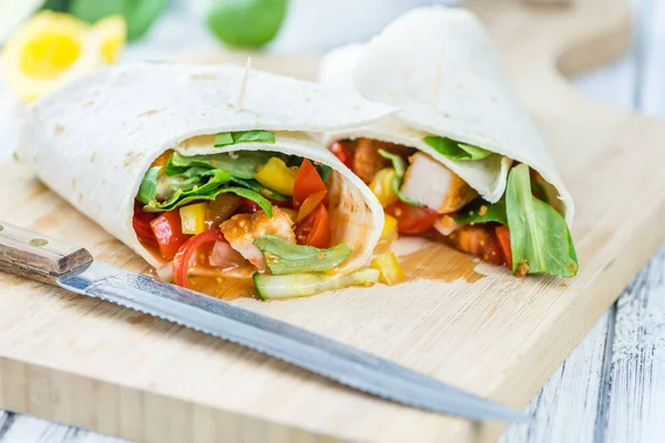 Chicken Wraps on wooden background — Stock Photo, Image